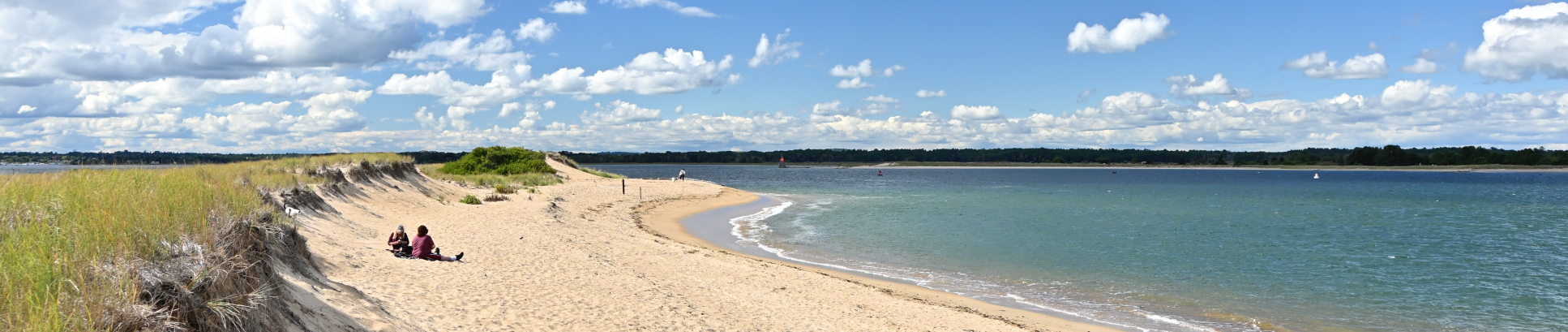 2 people sitting on Beach