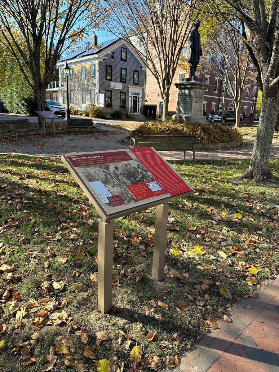 •	“Grant Us Our Liberty” interpretive sign near W.L. Garrison statue (photo by Geordie Vining, 11/17/2023)