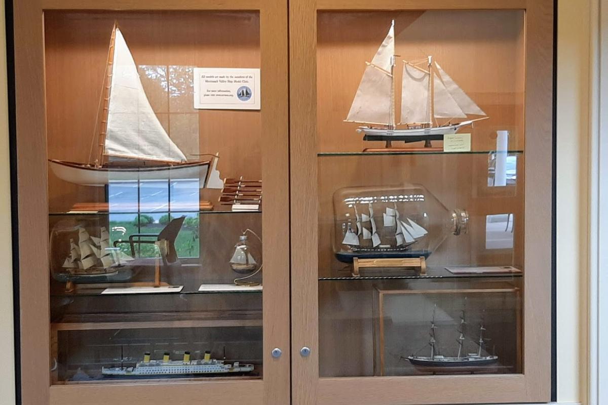 Display case filled with model ships