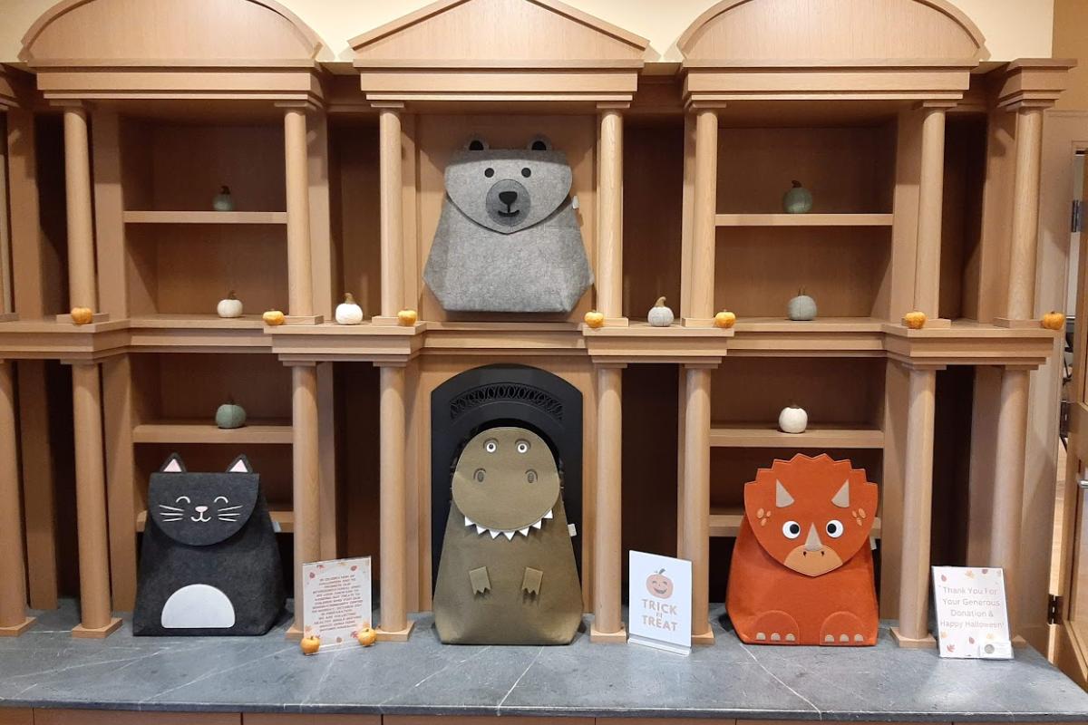 Display of Felt Animals in Front of Fireplace and Shelves