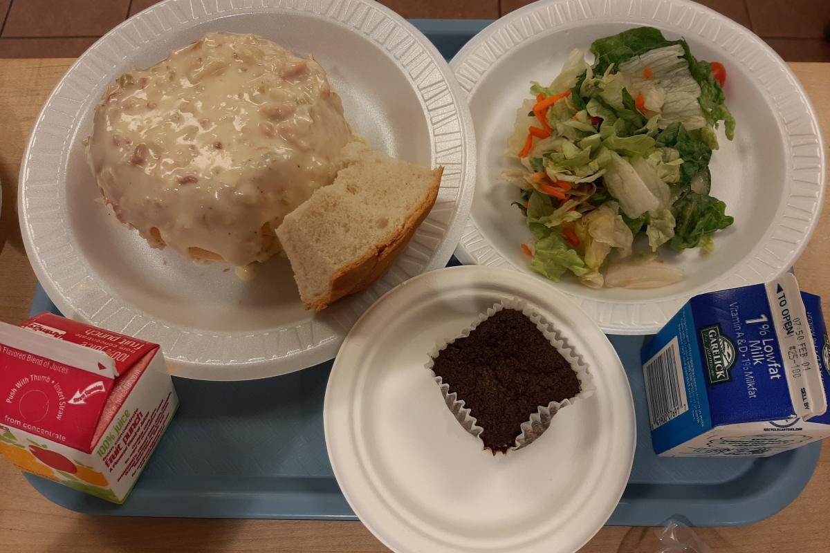 Clam chowder and garden salad and brownie ready to be served